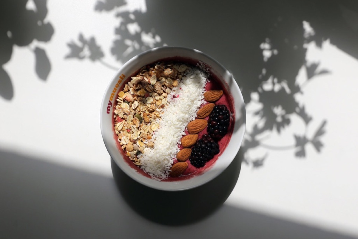 Before: the açaí bowl in harsh sun with leaf shadows